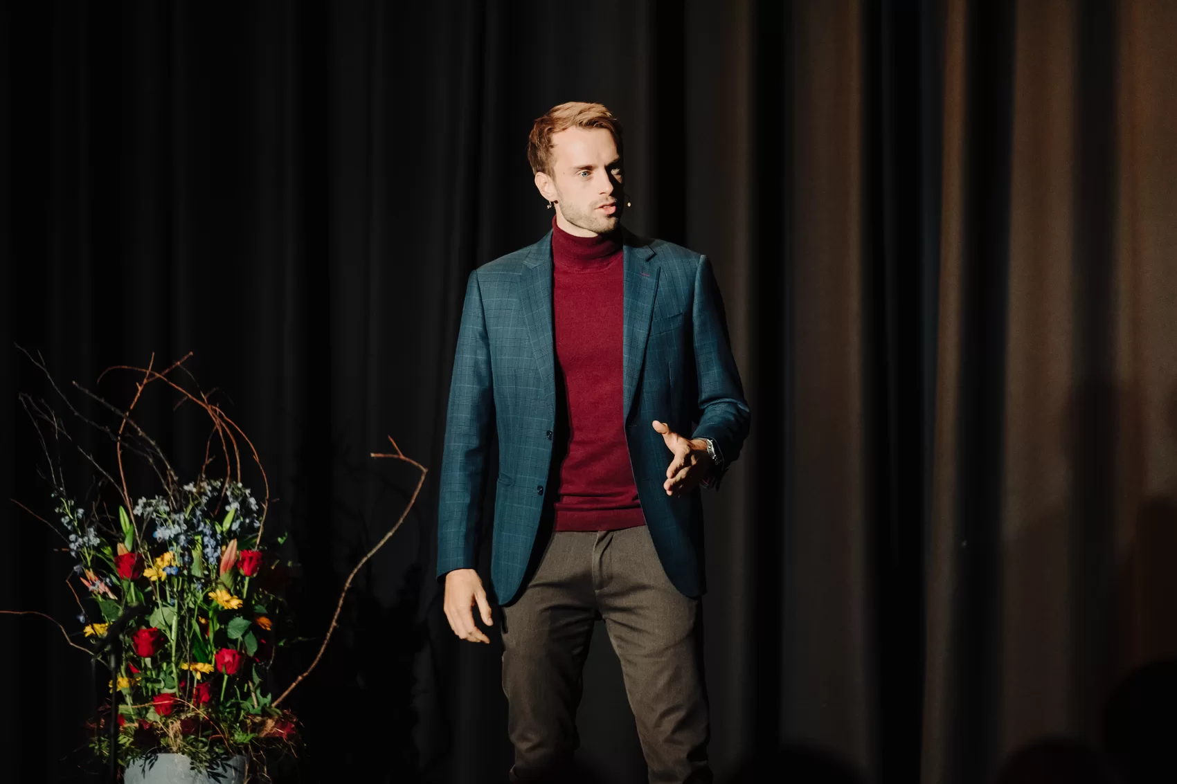 Hans Grane hosting a corporate event on stage as MC in Barbados